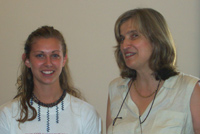 [(from left) Tanya Wedmid, student of Intermediate Ukrainian just received her graduation certificate from the HUSI Director Halyna Hryn at the graduation ceremony, August 15, 2003]